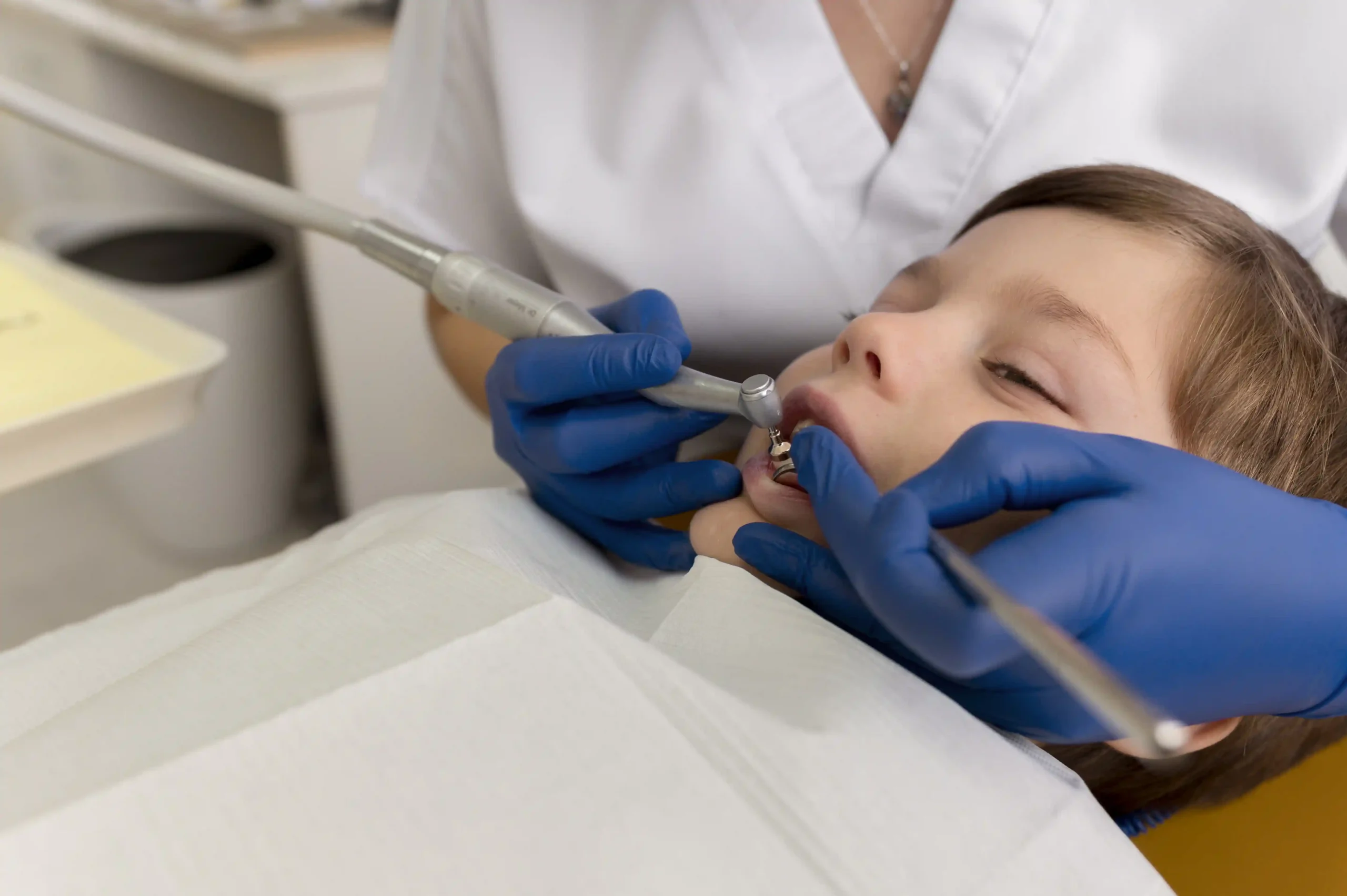 dentist-cleaning-child-s-teeth